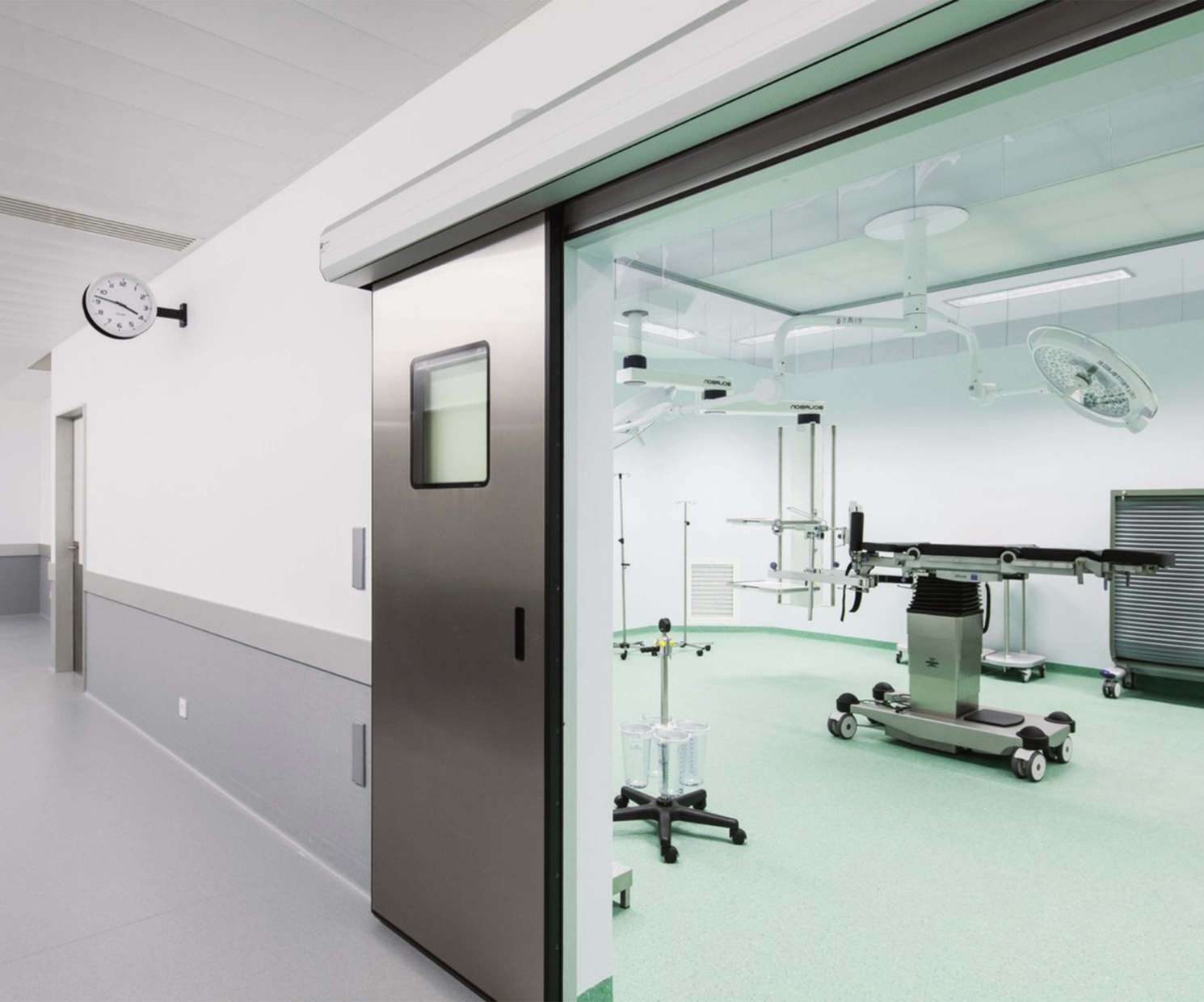 Sliding stainless steel and glass door of an operating room