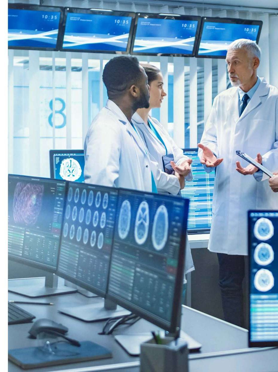 Radiologists reviewing images on monitors
